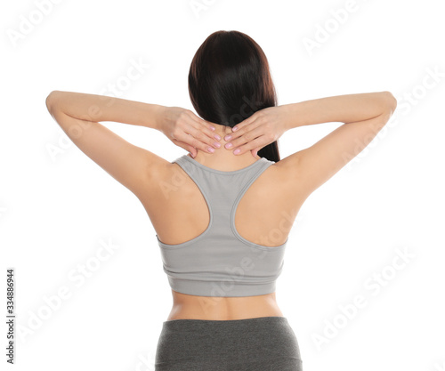 Woman suffering from pain in neck on white background. Visiting orthopedist © New Africa