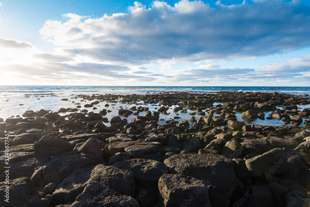 Beach with rocks at Port Fairy on Southern Ocean coast, Victoria Australia. Early morning light seascape in Summer Beach with rocks at Port Fairy on Southern Ocean coast, Victoria Australia. Early morning light seascape in Summer
