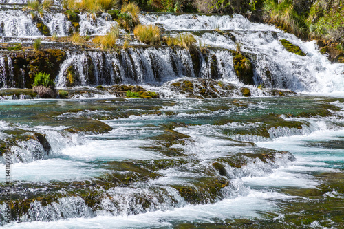 Small waterfall with clear turquoise water in Huancaya town, Lima Region, Peru