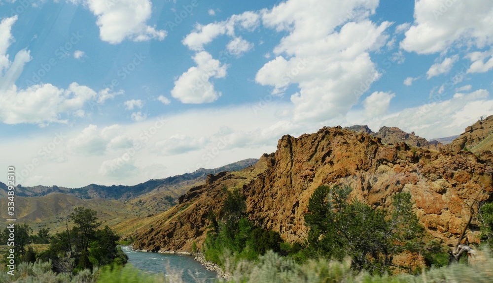 Panoramic view of jagged hills and mountains with the Shoshone River in Wyoming. Panoramic view of jagged hills and mountains with the Shoshone River in Wyoming.