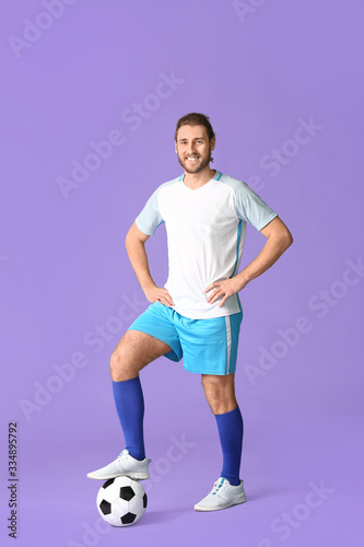 Male football player on color background © Pixel-Shot