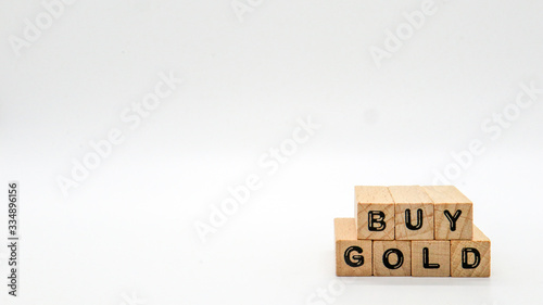 Wooden Text Block of "BUY GOLD" on Isolated Background