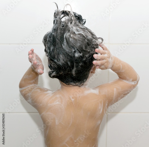 A girl washing hair and her body.