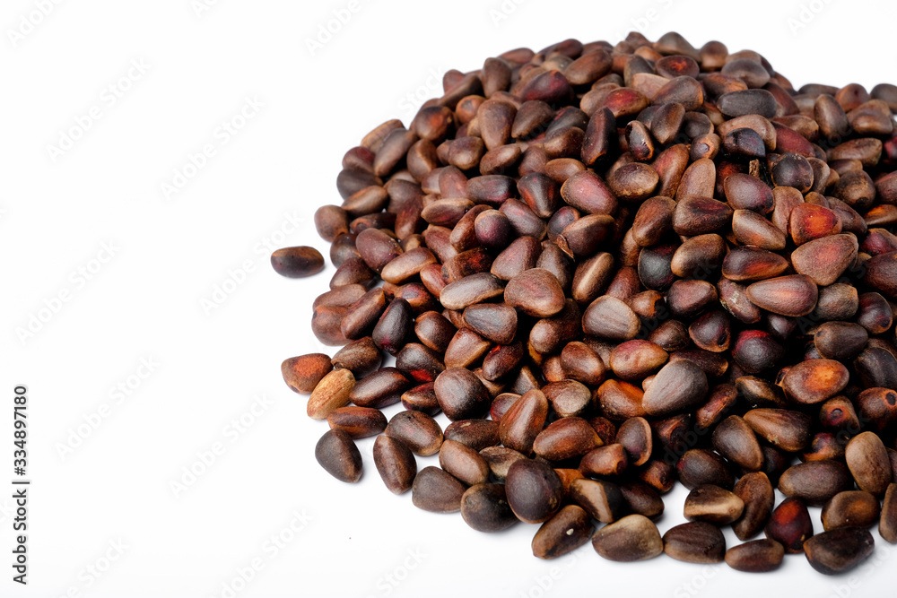 Fresh peeled cedar nuts isolated on white background, closeup Fresh peeled cedar nuts isolated on white background, closeup