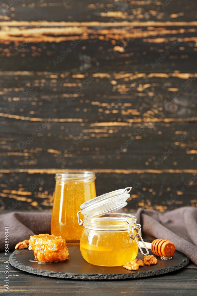 Jars of sweet honey on table Jars of sweet honey on table