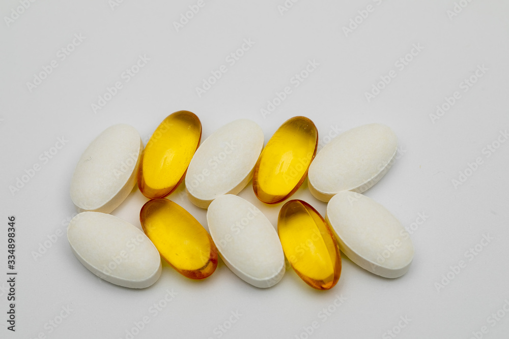 Vitamins omega 3 omega 6 calcium D3 close-up on a white background Vitamins omega 3 omega 6 calcium D3 close-up on a white background