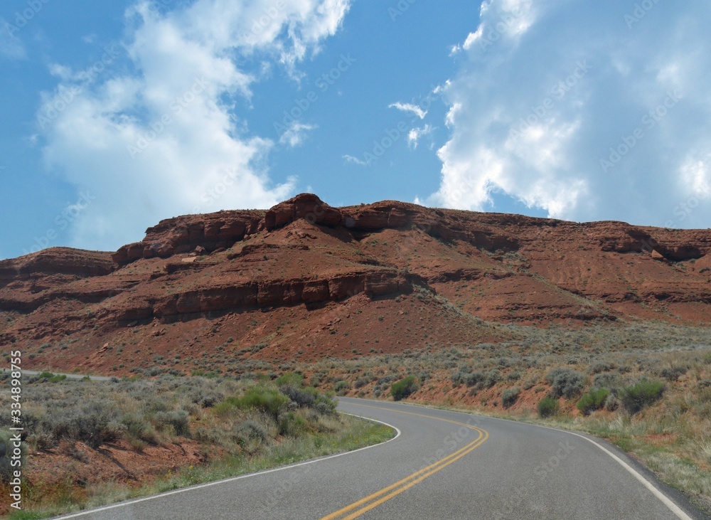 Stunning red canyons and rock platforms along winding roads in Wyoming.