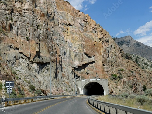 Wide shot of the impressive view of the entrance to the Shoshone Canyon tunnels next to the Buffalo Bill Dam in Wyoming.