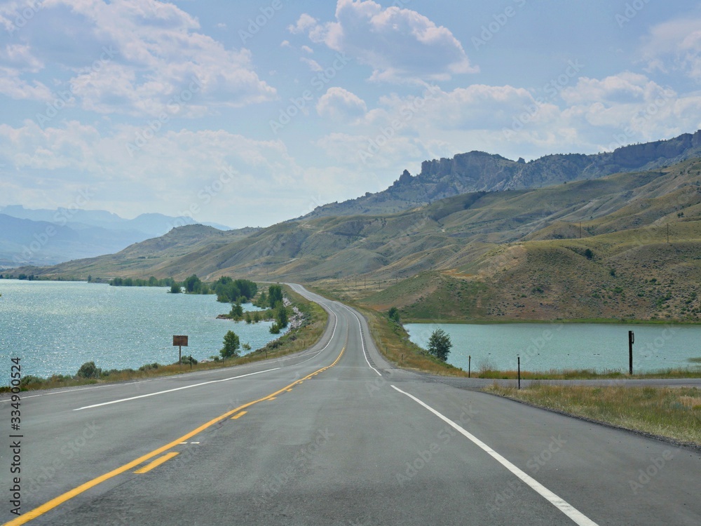 Scenic drive along North Fork Highway with the Buffalo Bill Reservoir and Dam along the road.