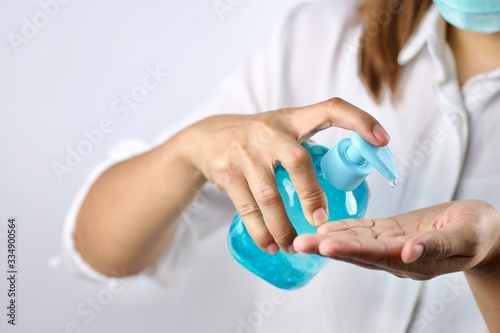 Health concept, young woman's hand is cleaning hands with alcohol gel To get rid of various germs and viruses.