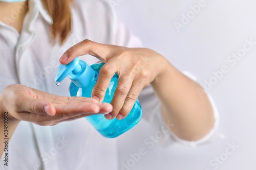 Health concept, young woman's hand is cleaning hands with alcohol gel To get rid of various germs and viruses.