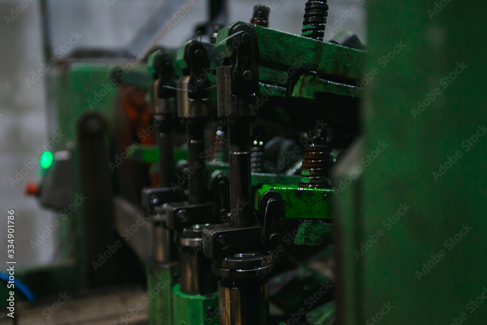 industrial conveyor for the production of wooden boxes for storing fruits and vegetables. industrial machine for the production of wooden boxes. machine tool in a factory
