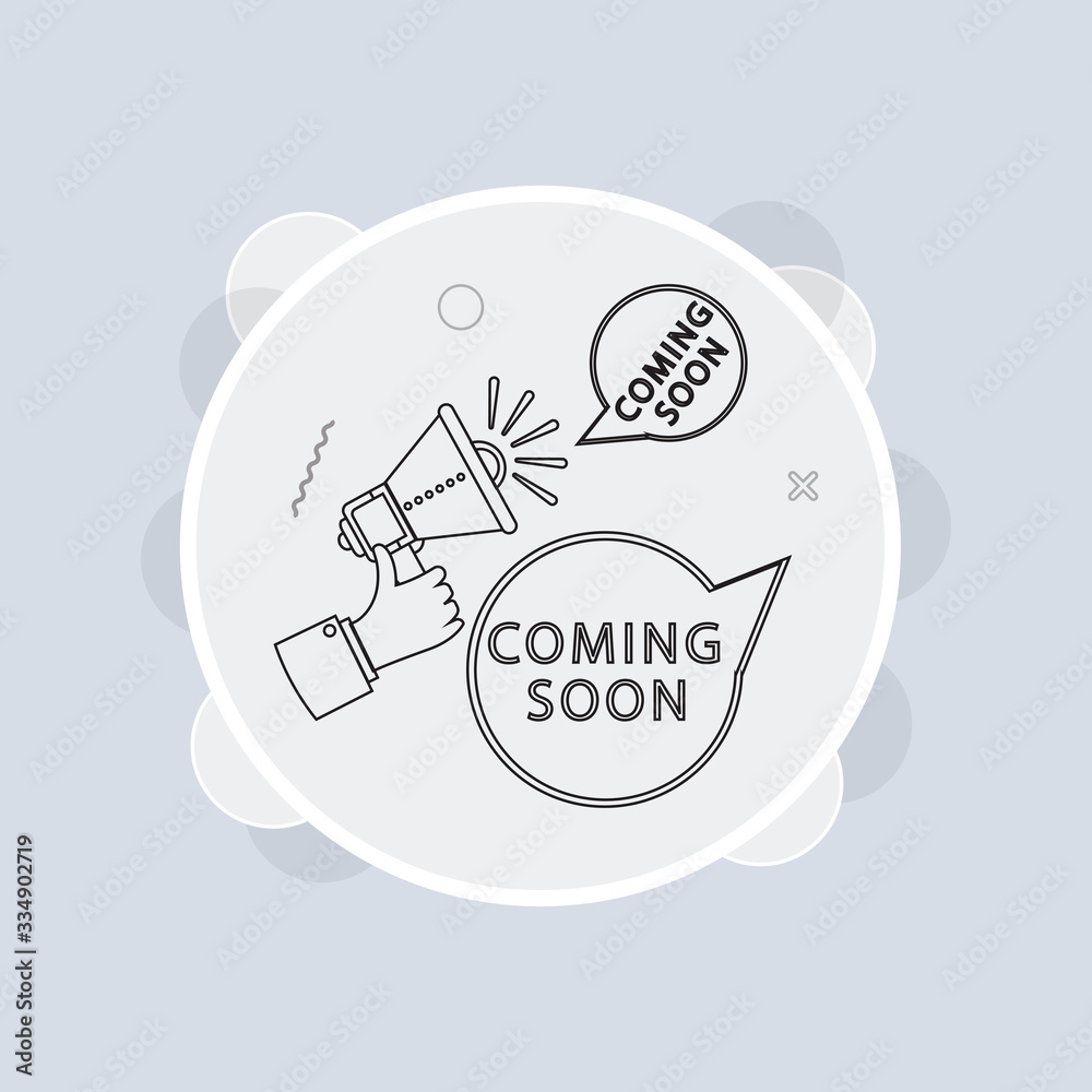 Male hand holding megaphone with coming soon speech bubble. Loudspeaker Male hand holding megaphone with coming soon speech bubble. Loudspeaker