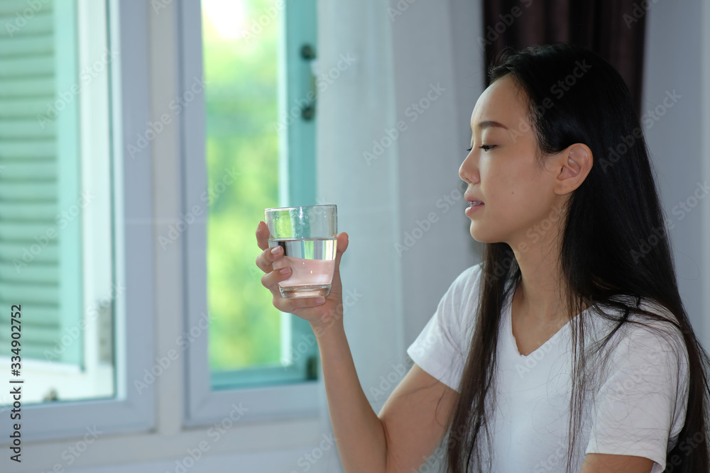 woman drinking glass of water and healthcare concept woman drinking glass of water and healthcare concept