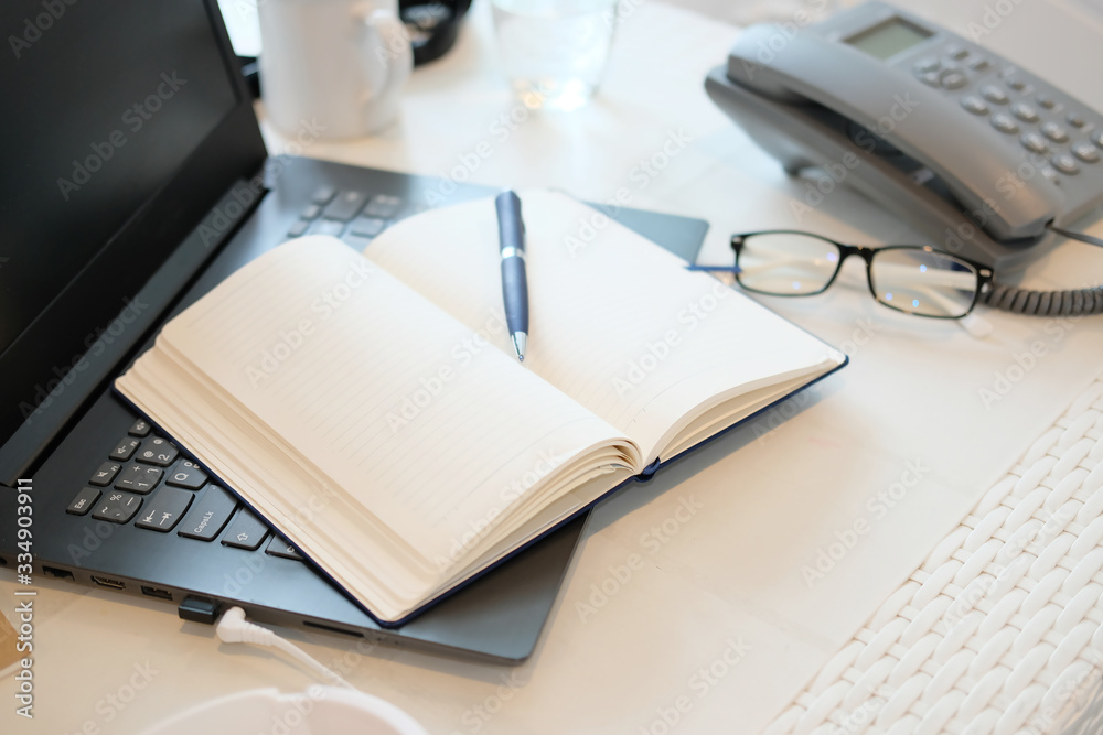 notebook and pen on table notebook and pen on table