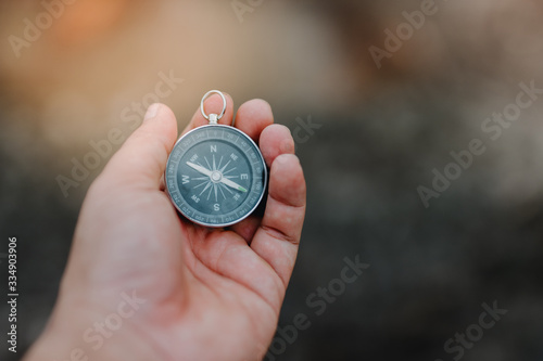 compass in hand isolated on white background