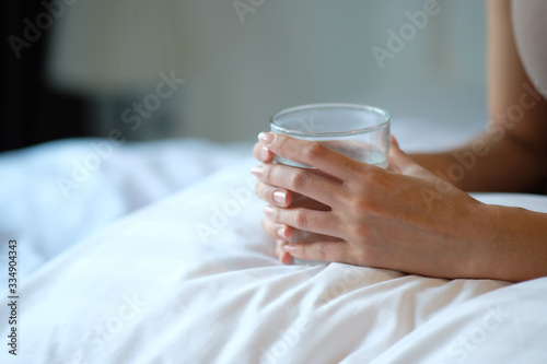 woman drinking glass of water and healthcare concept