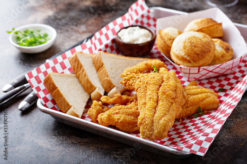 Photography Fried catfish with cornbread dipped with buttermilk and seasoned with cornmeal,