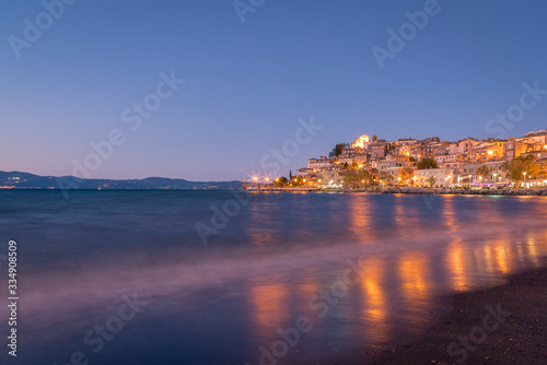Fototapeta Naklejka Na Ścianę i Meble -  Colourful reflections of lights on the water from the town of Anguillara Sabazia in Italy