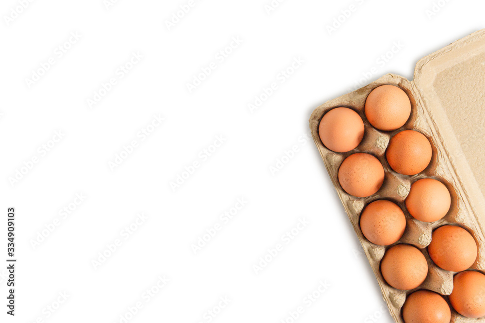 Eggs in a paper tray placed on a white background Eggs in a paper tray placed on a white background