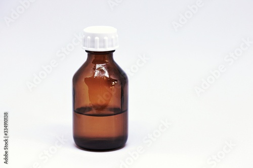 glass jar with liquid medicine or oil