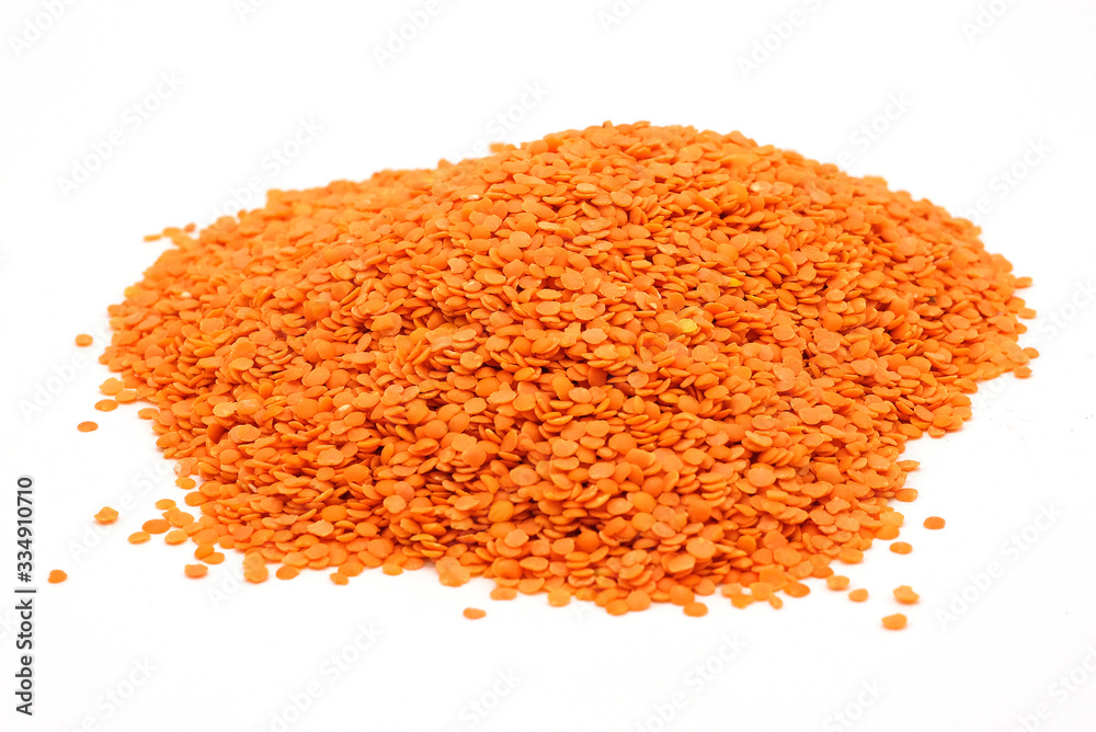 Heap of red lentil isolated for coulinar design Heap of red lentil isolated for coulinar design