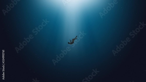 2d animation, young man drowns in a deep ocean. he sinks slowly. Sinking into the abyss photo