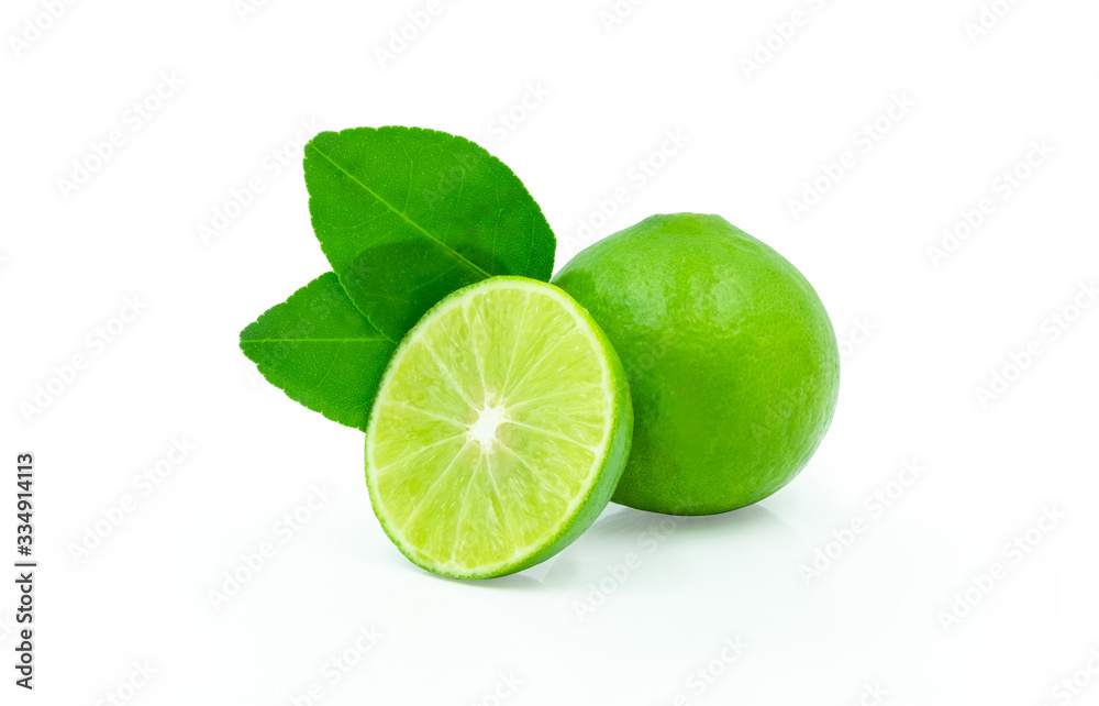 Close-up of Fresh whole limes with slices and leaves isolated on white background with clipping path.