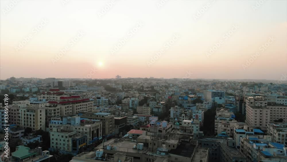 A forward motion drone shot above Hyderabad at sunset. A forward motion drone shot above Hyderabad at sunset.