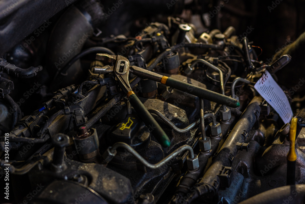 The modern engine of the European car is open for routine maintenance The modern engine of the European car is open for routine maintenance