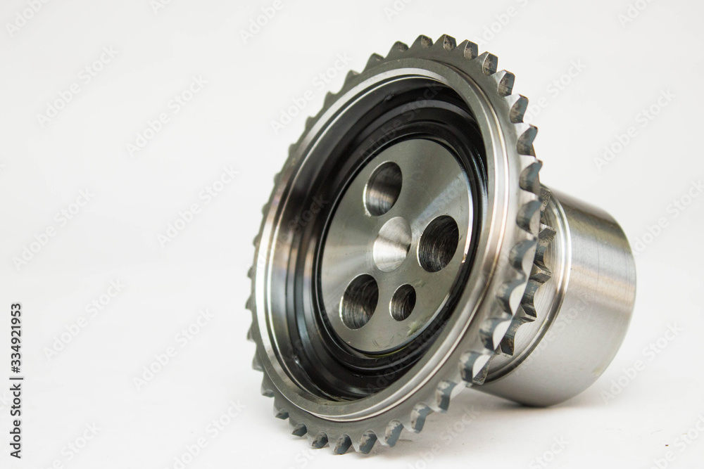 New details on a gray background. The camshaft gears,crankshaft gear. New details on a gray background. The camshaft gears,crankshaft gear.