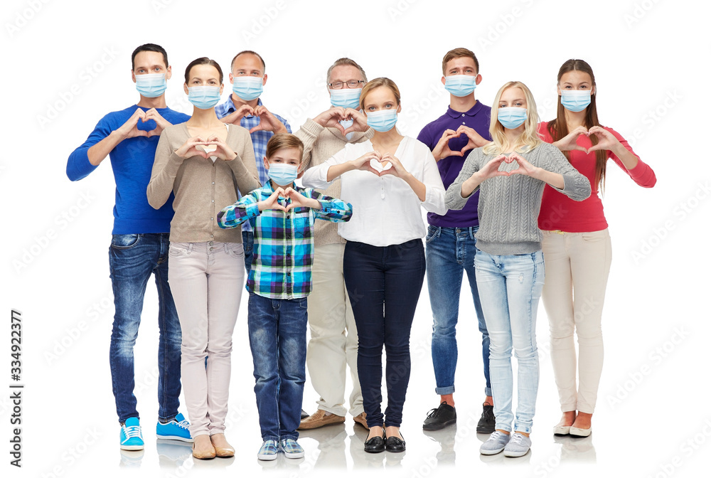 health, quarantine and pandemic concept - group of people wearing protective medical masks for protection from virus showing hand heart gesture - obrazy, fototapety, plakaty 