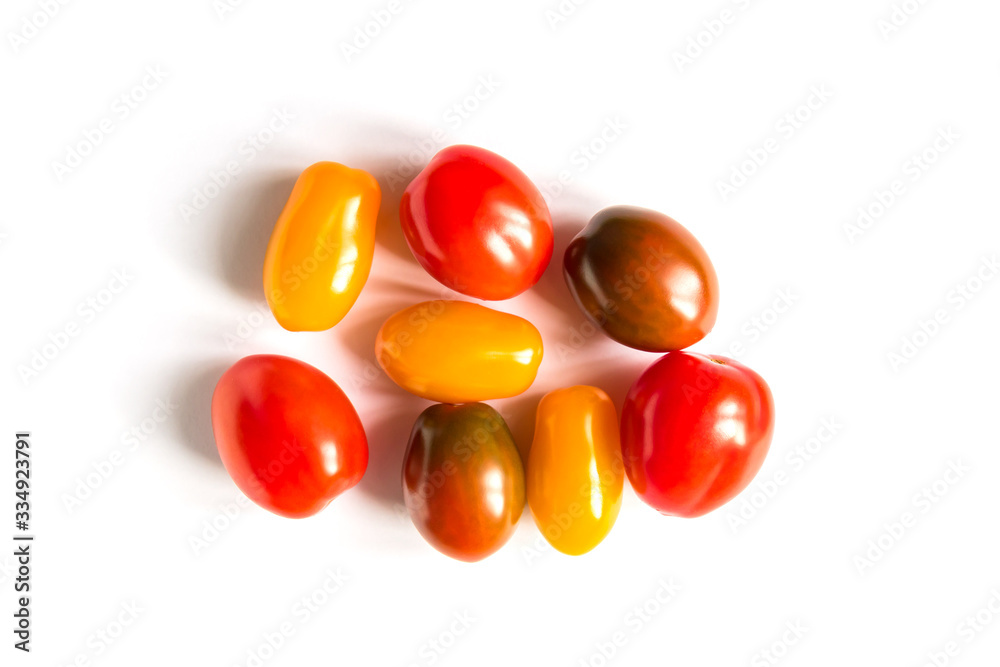 various colorful tomatoes on white background. Top view, flat lay. various colorful tomatoes on white background. Top view, flat lay.