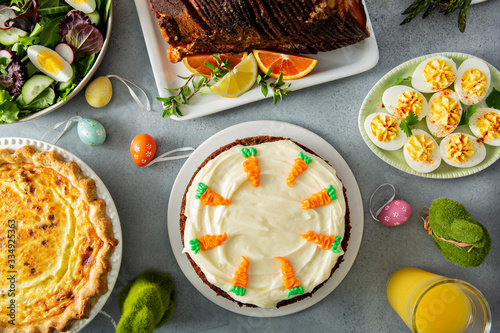 Big traditional Easter brunch with ham, quiche lorraine and carrot cake