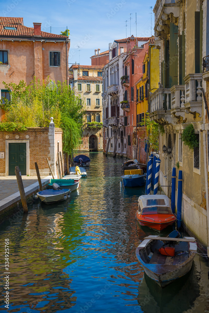 Sunny day on the city canal. Venice, Italy
