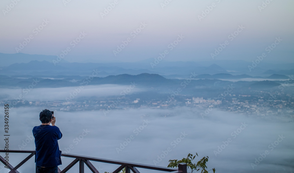 man looking at mountain view in loei province, thailand.