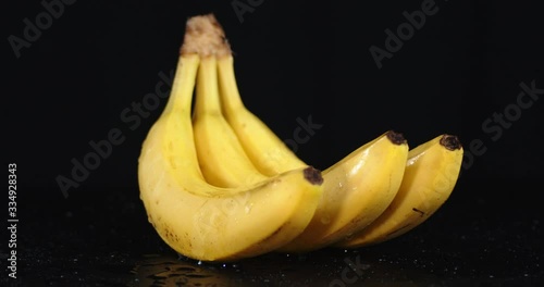 Ripe yellow bananas slowly rotate. photo