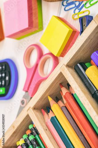 School supplies on wooden desk, close up view