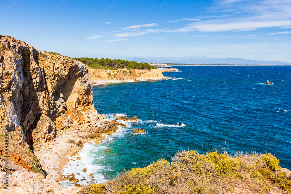 View of the cliffs of the Montgri Natural Park with the Bahía de Rosas in the background. Costa Brava, Catalonia, Spain