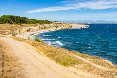 View of the coastal path that runs through the Montgri Natural Park. Costa Brava, Catalonia, Spain