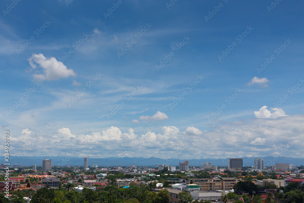 white cloud on blue sky above the town, aerial view cityscape