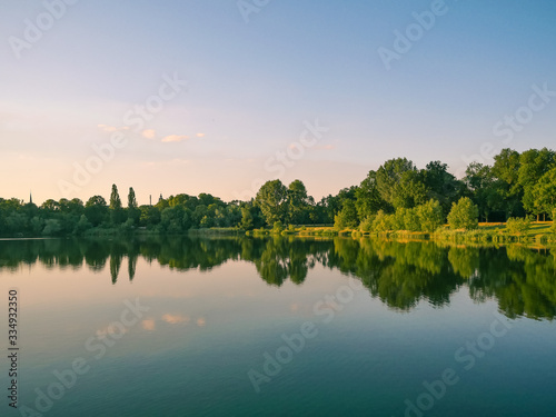Fototapeta Naklejka Na Ścianę i Meble -  Landscape of a forest reflected in the water of a lake