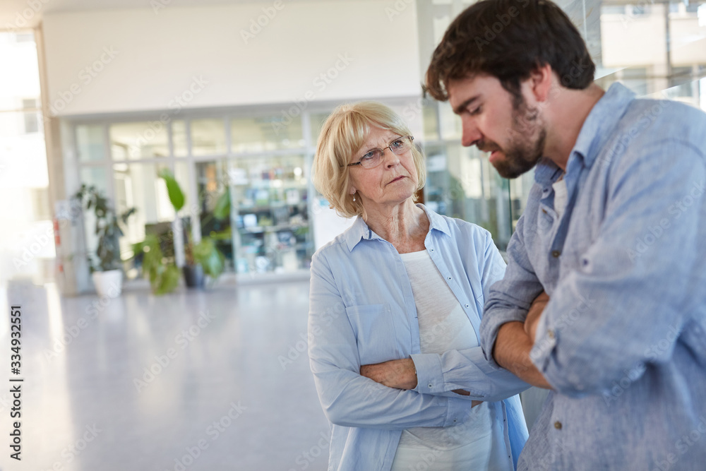 Teacher and lecturer discuss problem Teacher and lecturer discuss problem