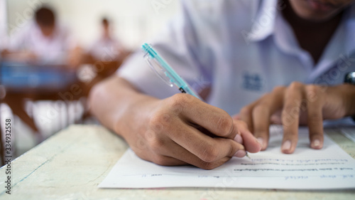 School students  taking exam answer in classroom with stress.16 9 style..