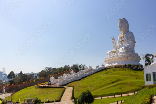 Great Bodhisattva Guan Yin Statue Large statue but Realistic proportion with Clear sky at Wat huay pla kang temple, Chiangrai,Thailand.