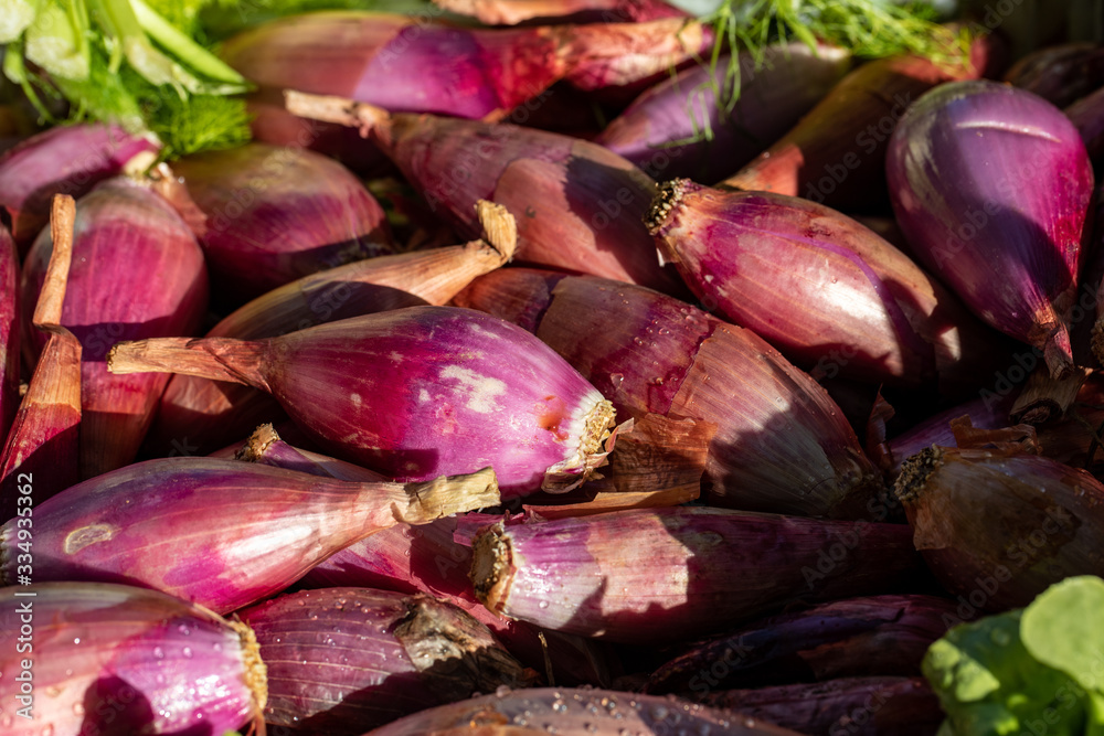 Red onions from Tropea (cipolla rossa di Tropea) at a farmers market in Italy