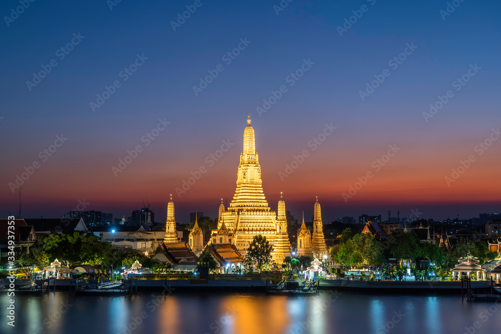Twilight view of Wat Arun Ratchawararam temple. Beautiful sunset at Chao Phraya river, landmark thailand tourist spot, Bangkok, Thailand