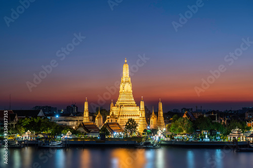 Twilight view of Wat Arun Ratchawararam temple. Beautiful sunset at Chao Phraya river, landmark thailand tourist spot, Bangkok, Thailand