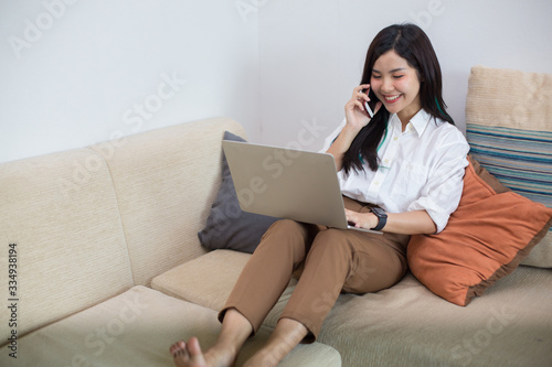 Asian woman Currently working at home "Work from home" concept because it protects against the pandemic Corona-virus. How to prevent yourself by staying at home "Stay at home"