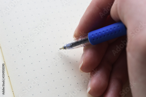 hand writes on a sheet